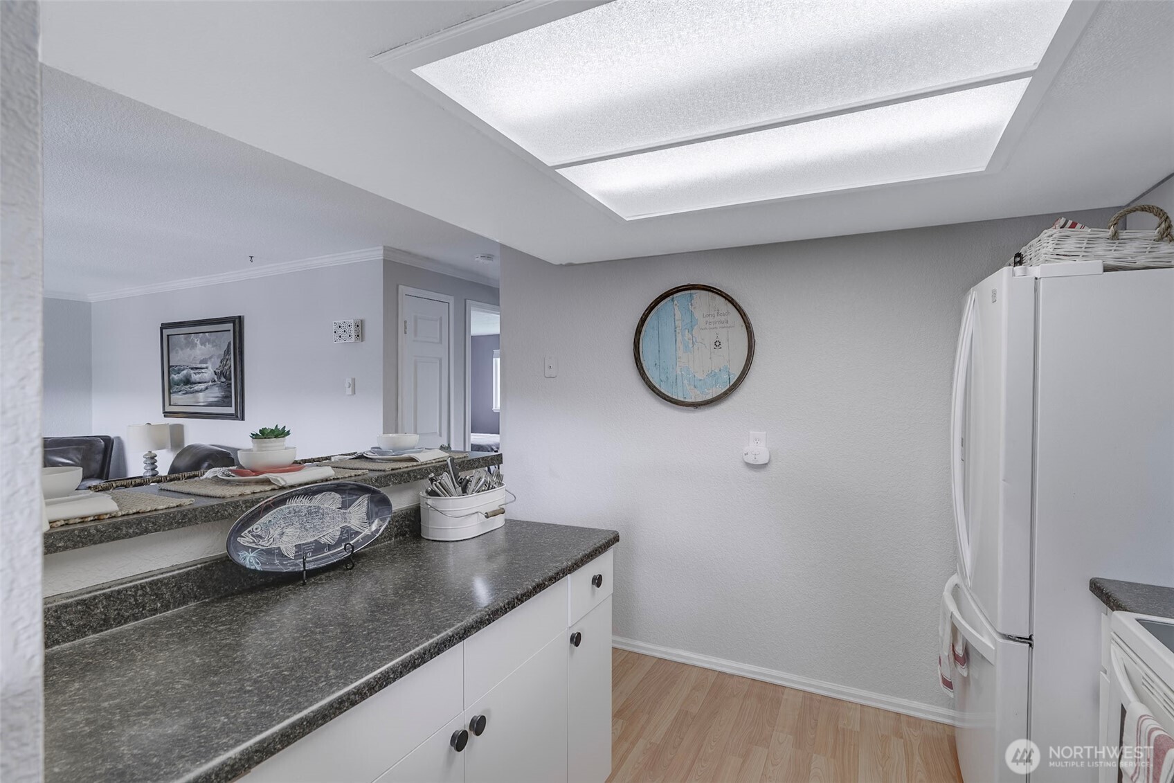 1420 48th Street, Unit B10 Seaview, WA 98644 - Photo 9 of 20 a kitchen with a sink and a stove top oven