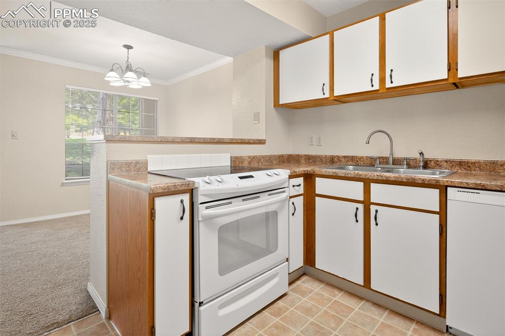 2190 Alicia Point, Unit 101 Colorado Springs, CO 80919 - Photo 11 of 33 a utility room with sink dryer and washer