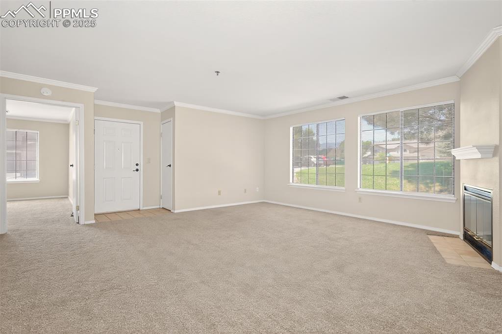 2190 Alicia Point, Unit 101 Colorado Springs, CO 80919 - Photo 12 of 33 a view of an empty room with a window