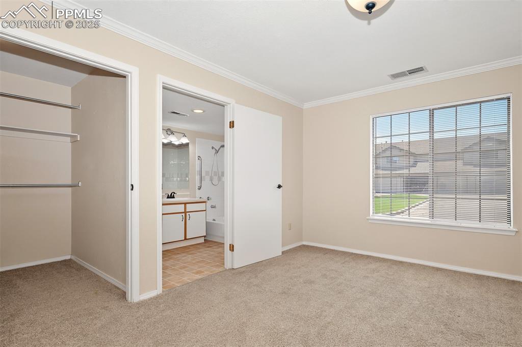 2190 Alicia Point, Unit 101 Colorado Springs, CO 80919 - Photo 14 of 33 an empty room with windows and closet