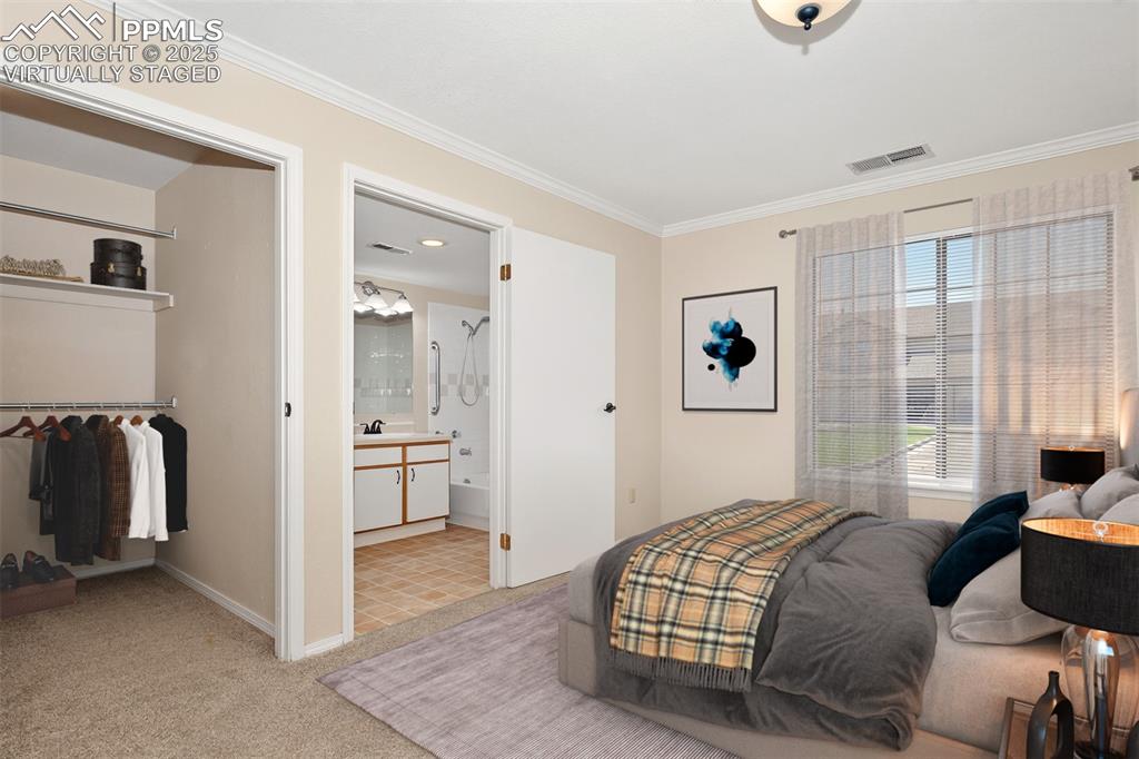 2190 Alicia Point, Unit 101 Colorado Springs, CO 80919 - Photo 15 of 33 a bedroom with a bed and a couch