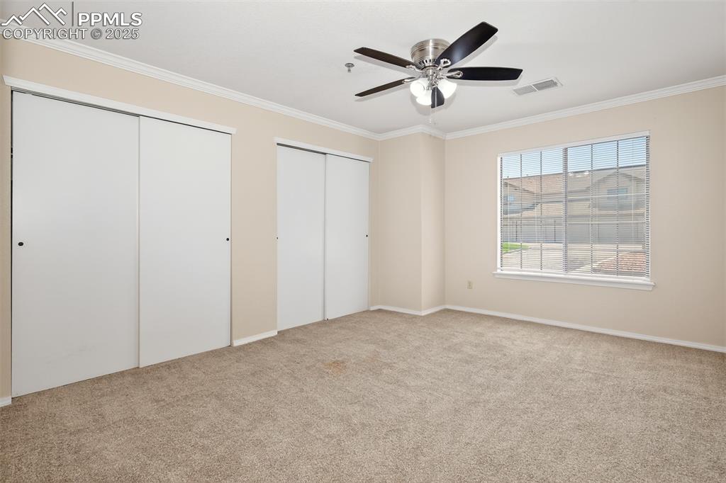 2190 Alicia Point, Unit 101 Colorado Springs, CO 80919 - Photo 18 of 33 a view of an empty room with a window