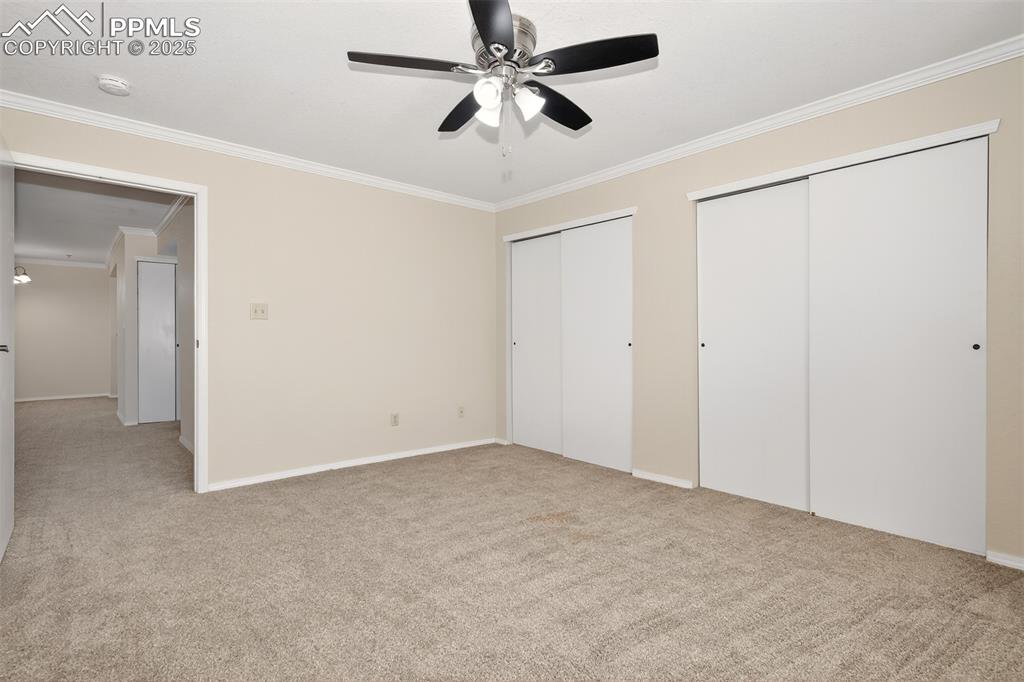 2190 Alicia Point, Unit 101 Colorado Springs, CO 80919 - Photo 20 of 33 an empty room with chandelier fan