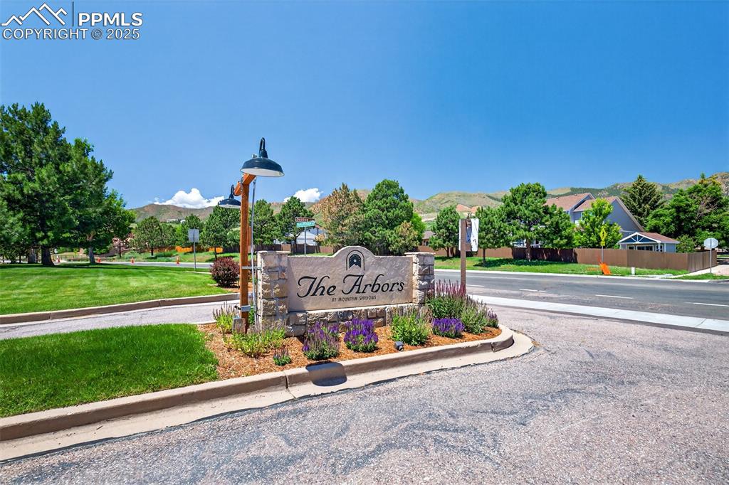 2190 Alicia Point, Unit 101 Colorado Springs, CO 80919 - Photo 27 of 33 a sign board with a garden and stairs