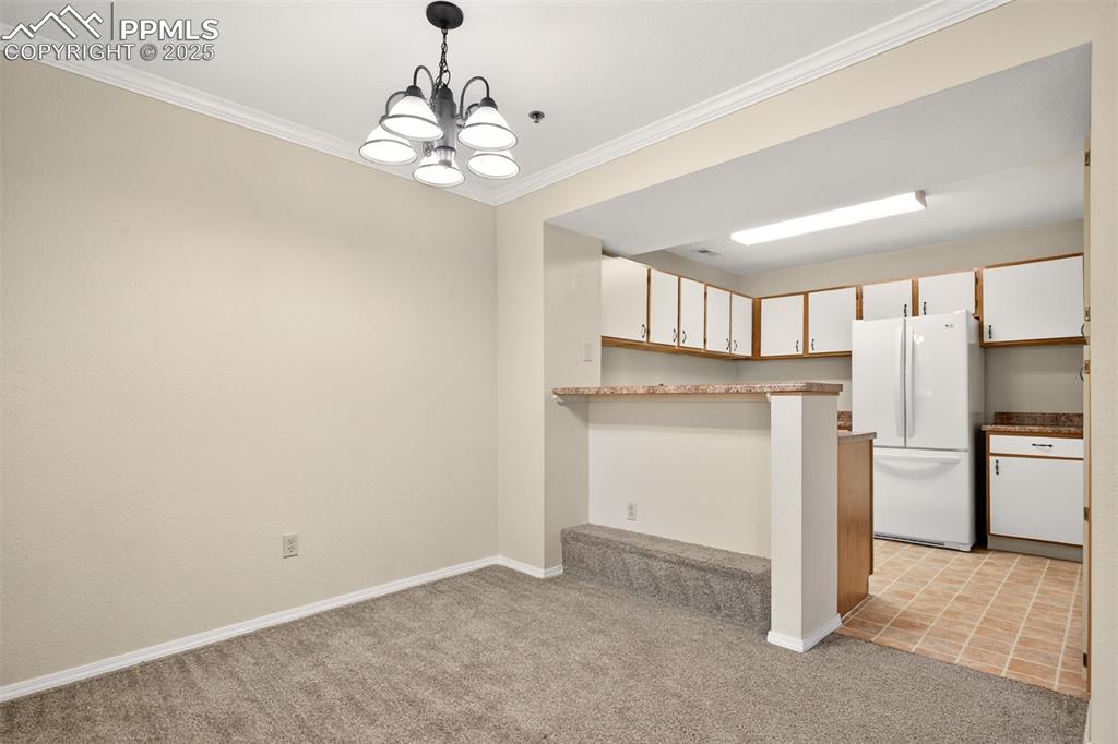 2190 Alicia Point, Unit 101 Colorado Springs, CO 80919 - Photo 7 of 33 a view of a kitchen with a sink