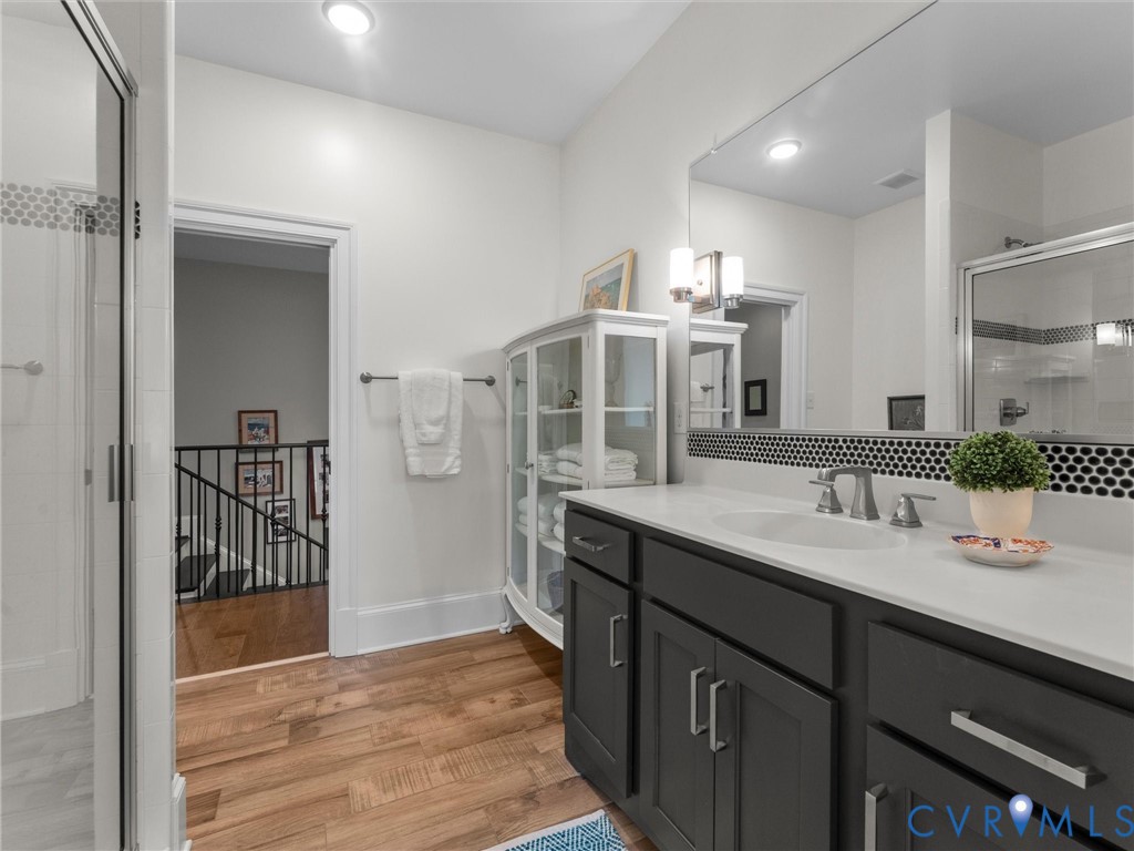 16131 Binley Road Midlothian, VA 23112 - Photo 79 of 99 a bathroom with a sink and mirror