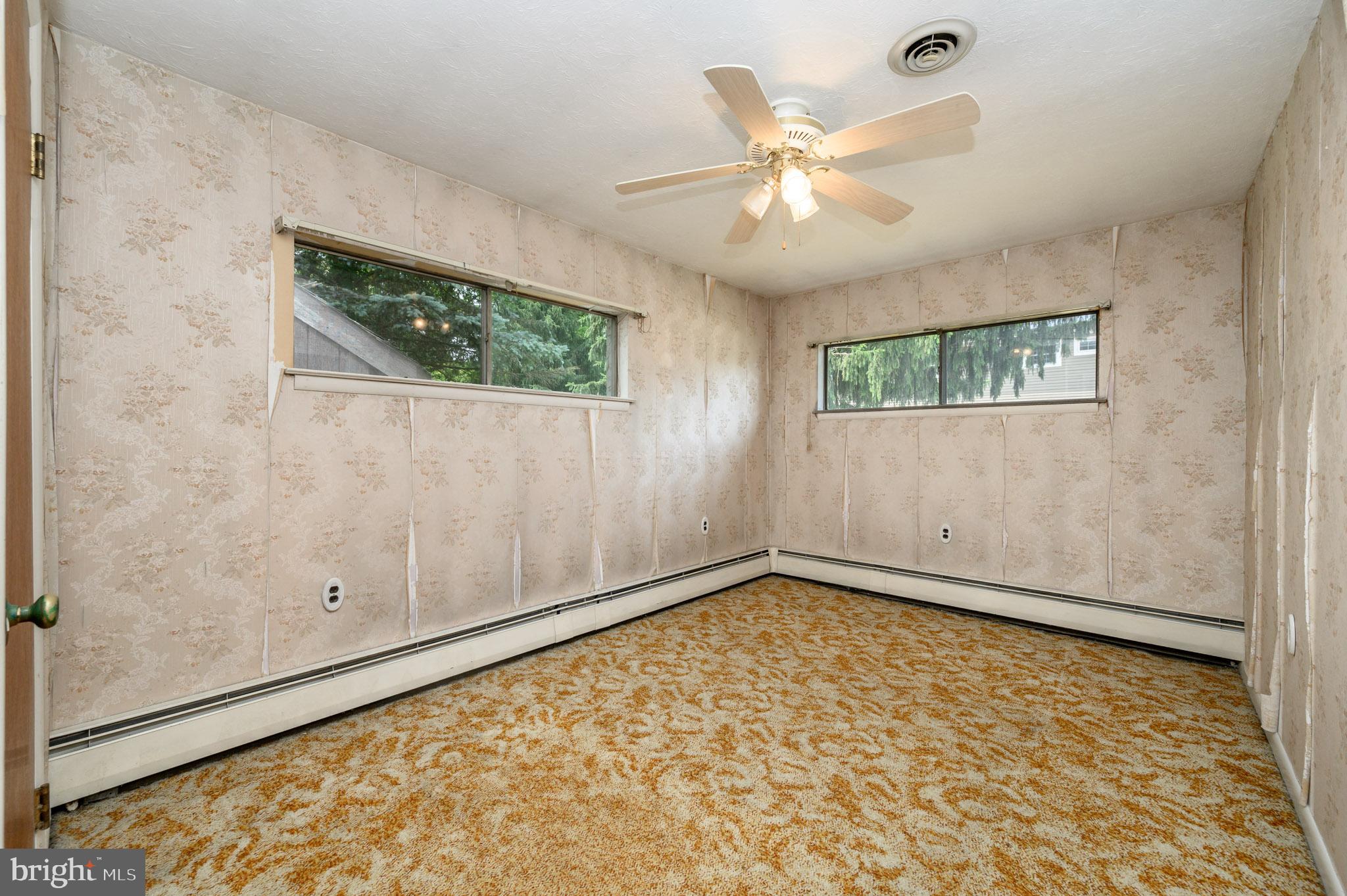 861 Centerton Road Mount Laurel, NJ 08054 - Photo 16 of 43 an empty room with wooden floor fan and windows