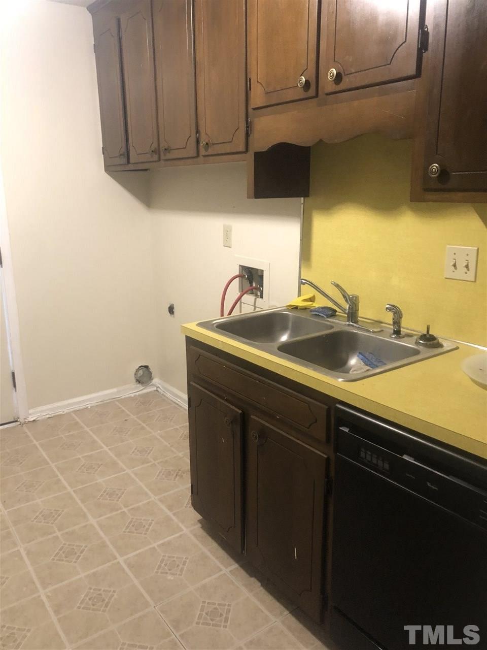 926 Jason Court Cary, NC 27511 - Photo 4 of 10 a kitchen with a sink and cabinets