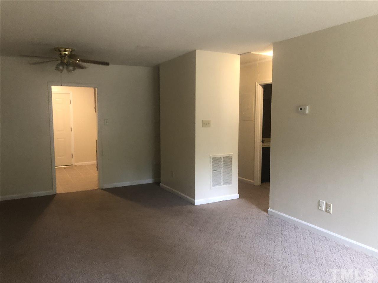 926 Jason Court Cary, NC 27511 - Photo 6 of 10 an empty room with windows and closet