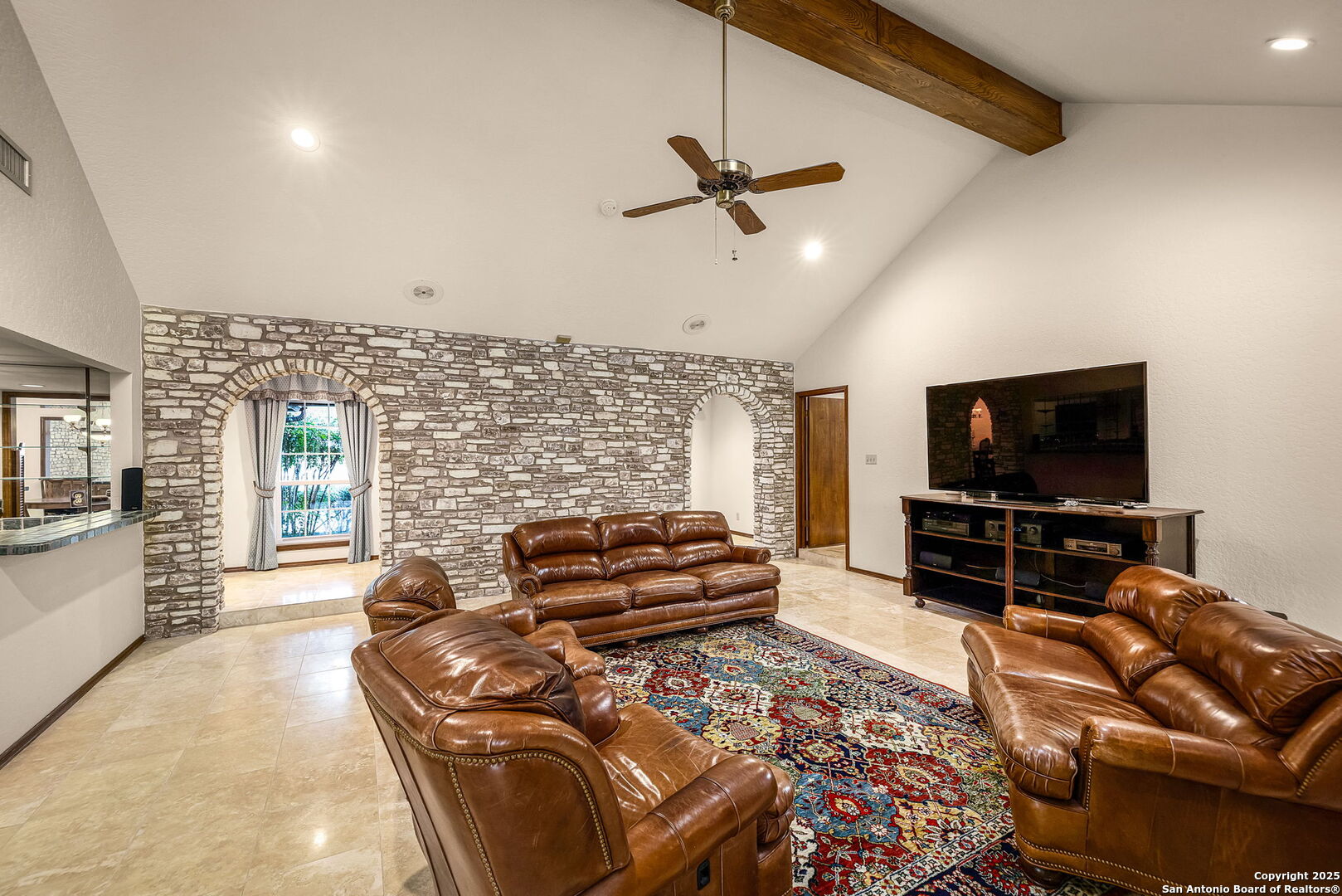 9606 Meadow Rue Garden Ridge, TX 78266 - Photo 15 of 60 a living room with furniture and a flat screen tv