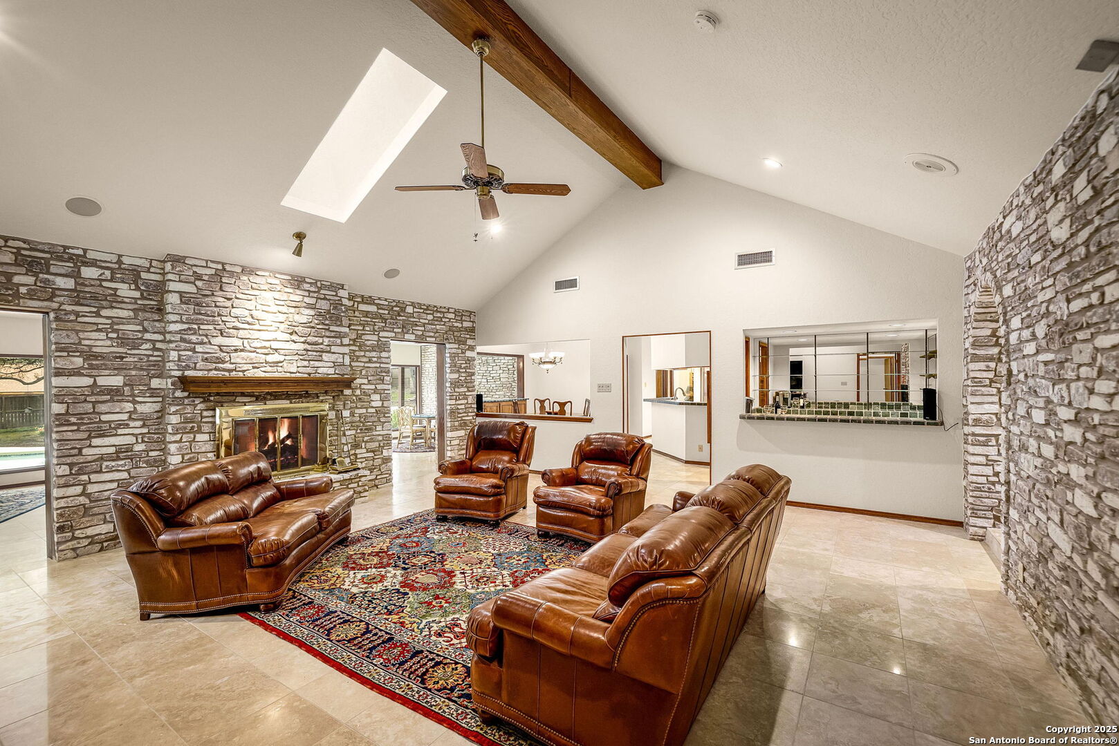 9606 Meadow Rue Garden Ridge, TX 78266 - Photo 17 of 60 a living room with furniture or couch and a fireplace