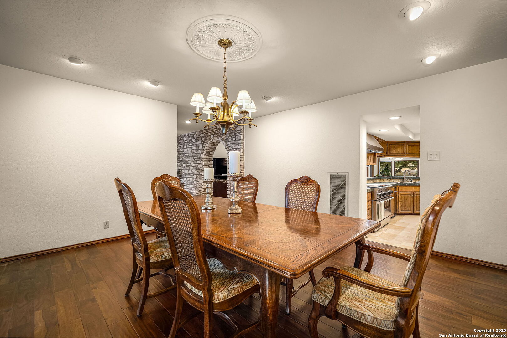 9606 Meadow Rue Garden Ridge, TX 78266 - Photo 18 of 60 a view of a dining room with furniture and wooden floor
