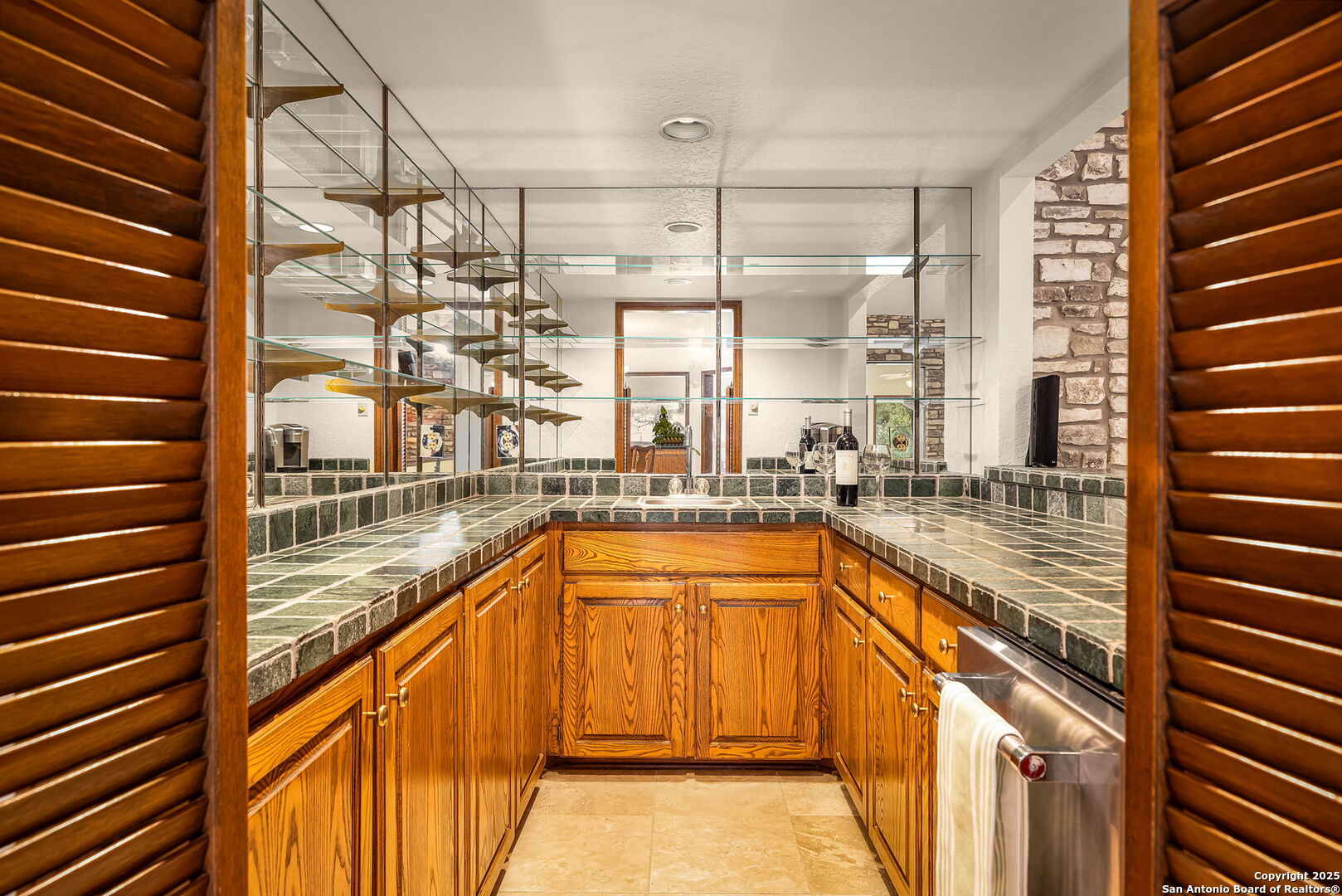 9606 Meadow Rue Garden Ridge, TX 78266 - Photo 21 of 60 a view of a kitchen with a sink and cabinets