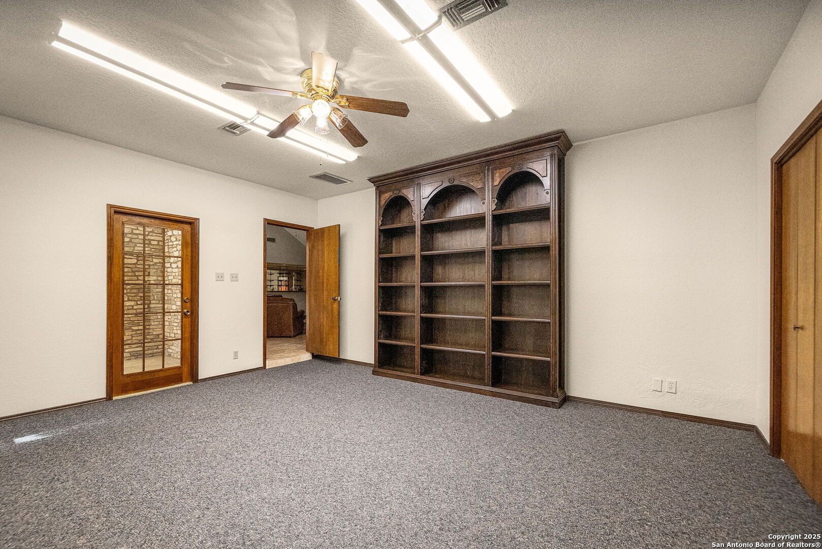 9606 Meadow Rue Garden Ridge, TX 78266 - Photo 45 of 60 a view of an empty room with a cabinet and a window