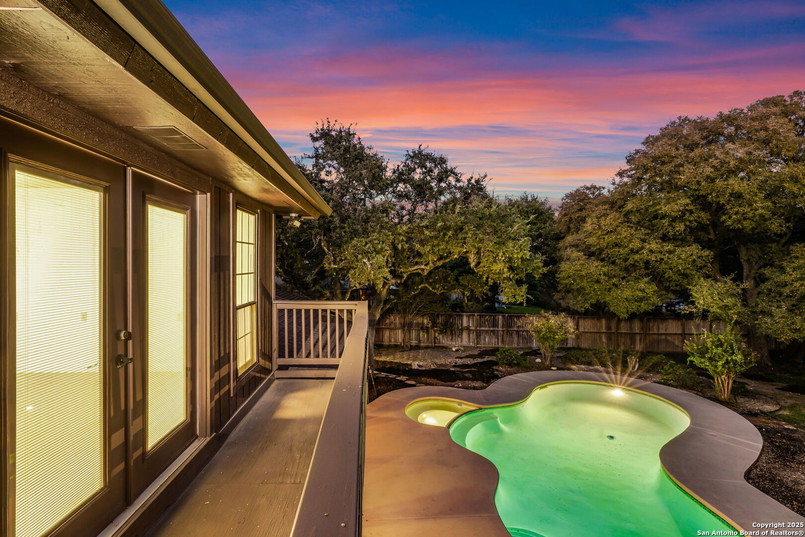 9606 Meadow Rue Garden Ridge, TX 78266 - Photo 57 of 60 a view of a swimming pool with a lounge chairs