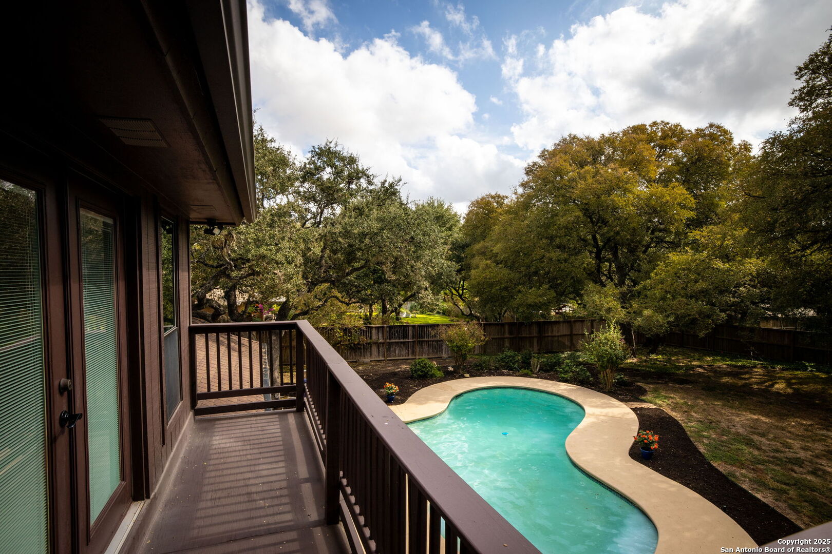 9606 Meadow Rue Garden Ridge, TX 78266 - Photo 6 of 60 a view of a balcony with wooden floor and outdoor seating