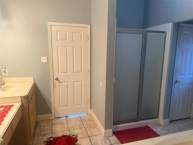 a view of a kitchen from the hallway