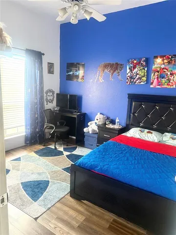 a bed sitting in a room next to a window