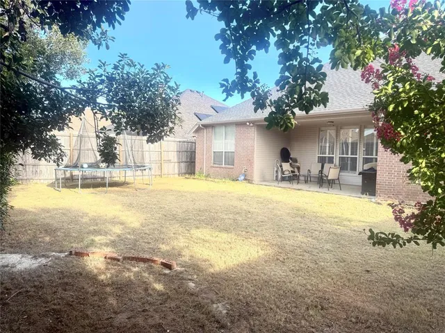a house with swimming pool in front of it
