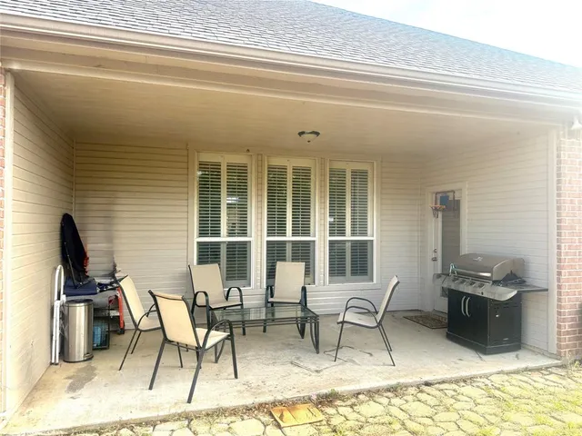 a view of a workspace with furniture