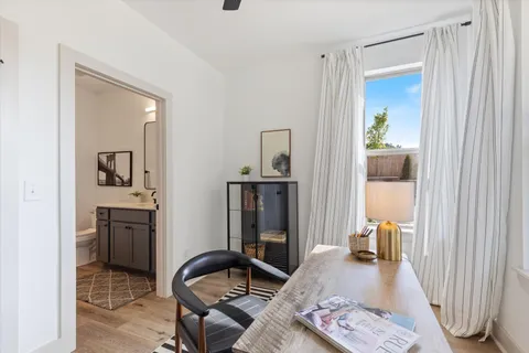 a bedroom with furniture and a window