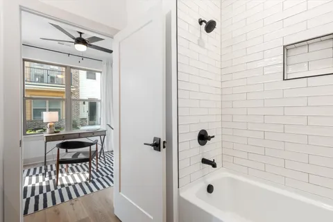 a bathroom with a bathtub and a shower