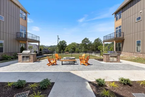 an outdoor space with patio furniture