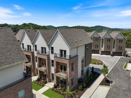 an aerial view of a house with a big yard