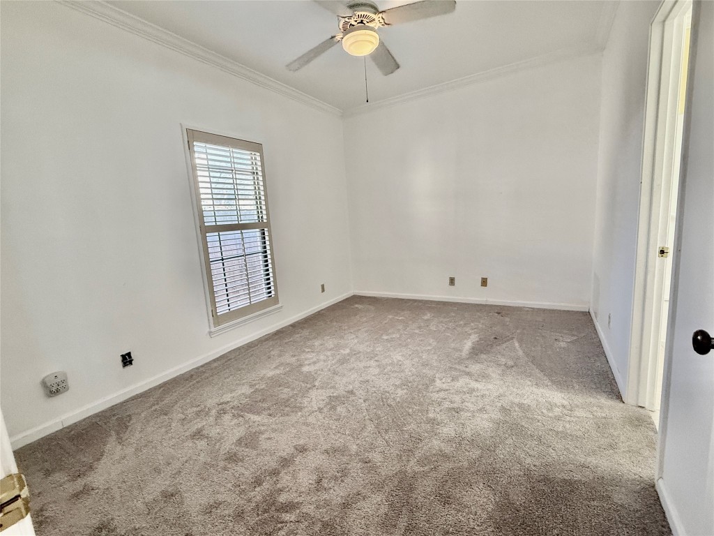 1307 Kinney Avenue, Unit 133 Austin, TX 78704 - Photo 15 of 24 an empty room with a ceiling fan and window