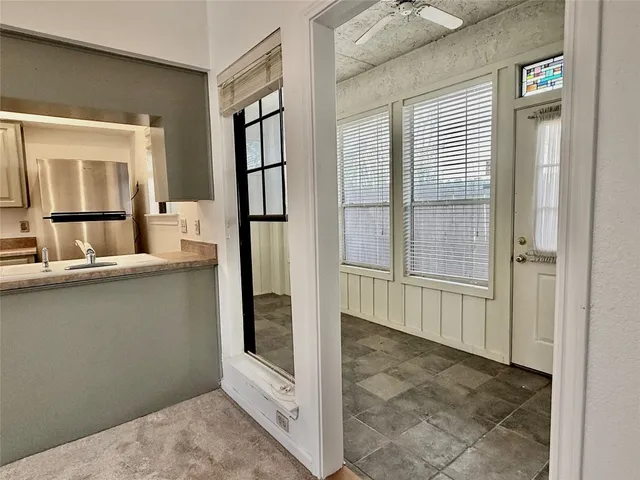 a view of a hallway with windows