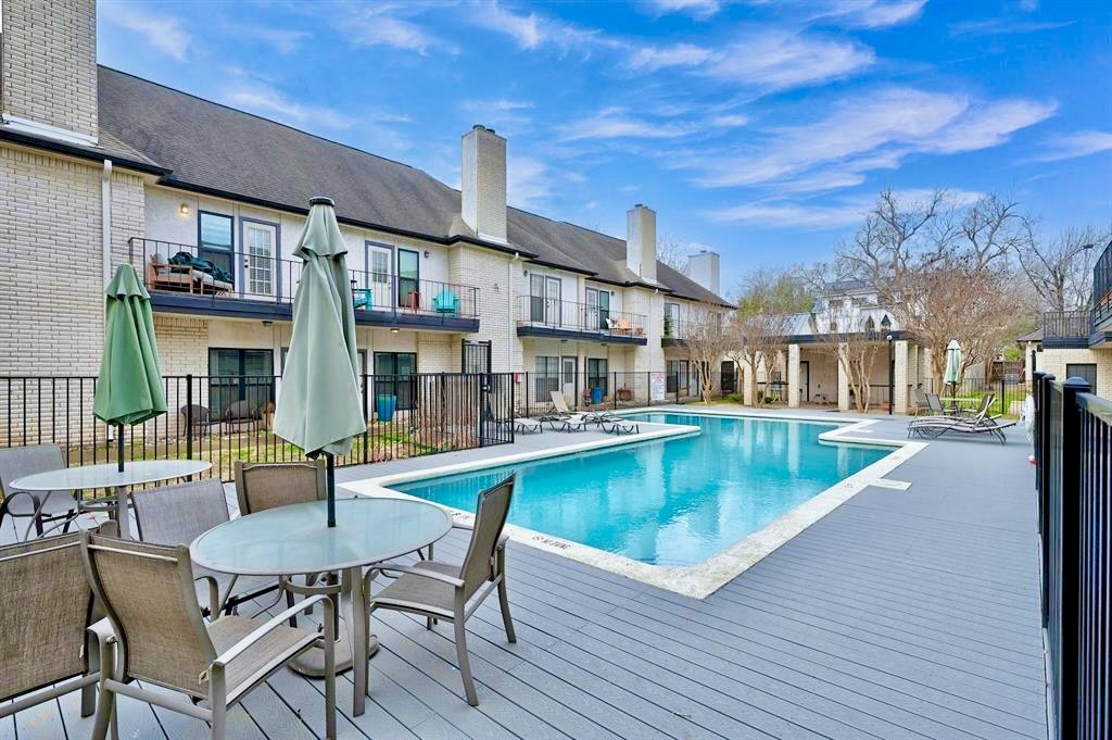 1307 Kinney Avenue, Unit 133 Austin, TX 78704 - Photo 23 of 24 a view of a house with pool and chairs