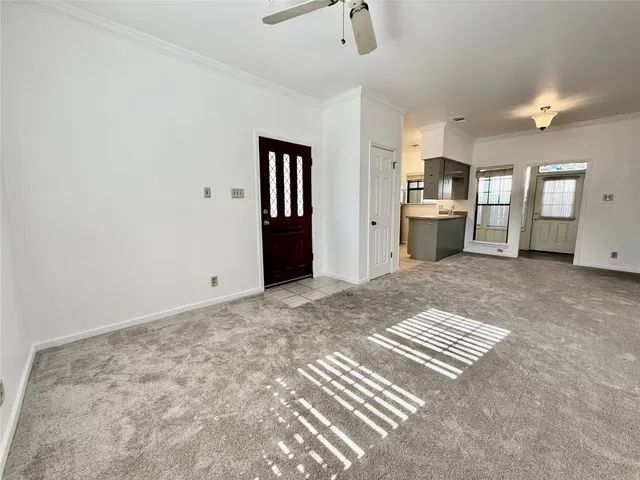 a view of kitchen and hall with wooden floor