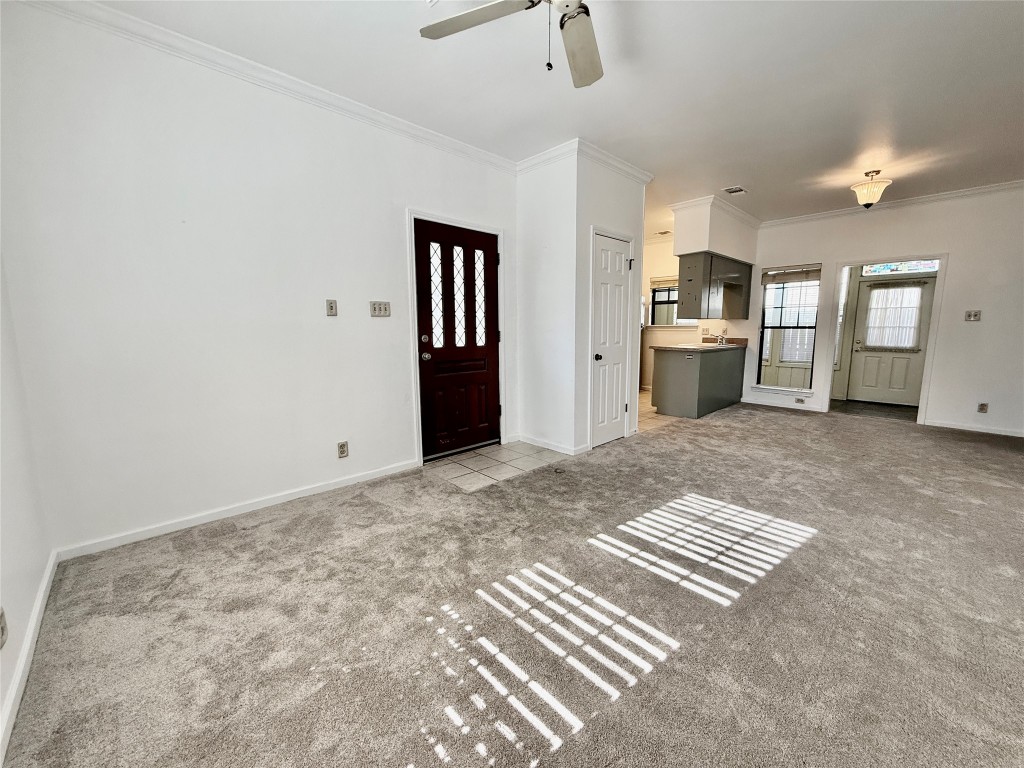 1307 Kinney Avenue, Unit 133 Austin, TX 78704 - Photo 6 of 24 a view of kitchen and hall with wooden floor