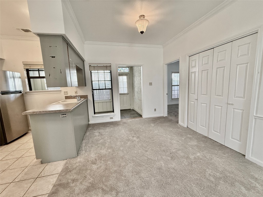 1307 Kinney Avenue, Unit 133 Austin, TX 78704 - Photo 7 of 24 a view of a kitchen with refrigerator and windows