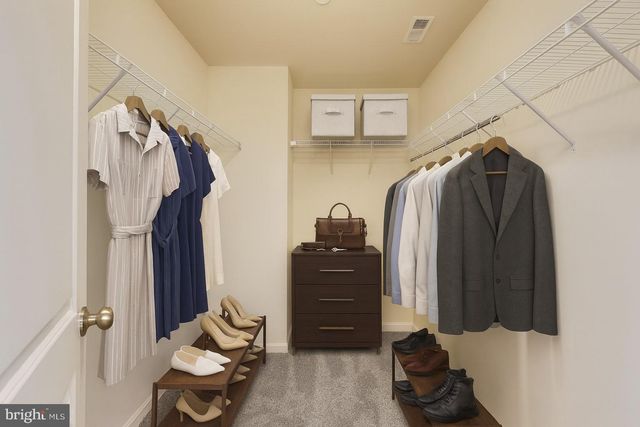 a bathroom with a granite countertop sink a large mirror and a bathtub with shower