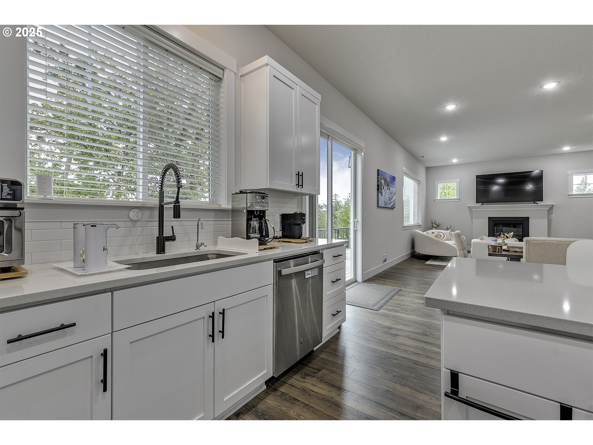 15080 Northwest Legend Street Portland, OR 97229 - Photo 13 of 38 a kitchen with sink a stove and cabinets