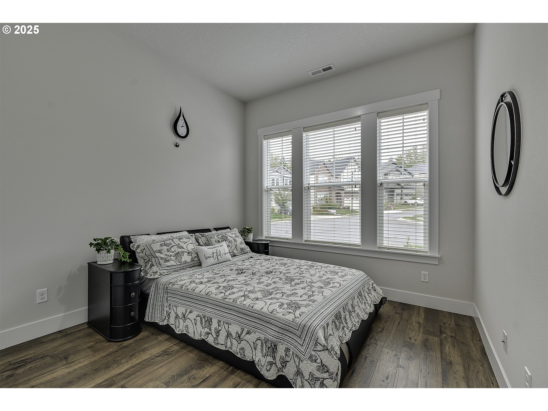 15080 Northwest Legend Street Portland, OR 97229 - Photo 18 of 38 a bed sitting in a bedroom next to a window
