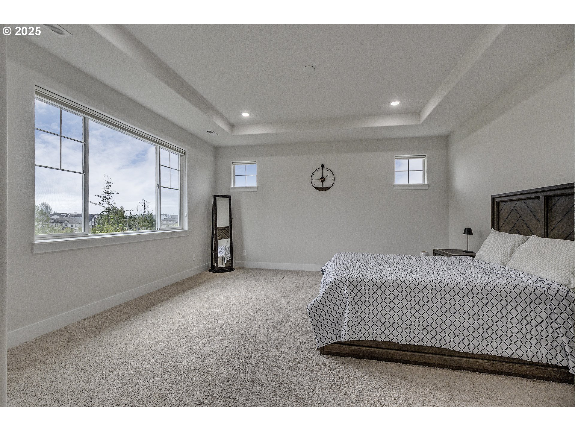 15080 Northwest Legend Street Portland, OR 97229 - Photo 21 of 38 a spacious bedroom with a bed and window