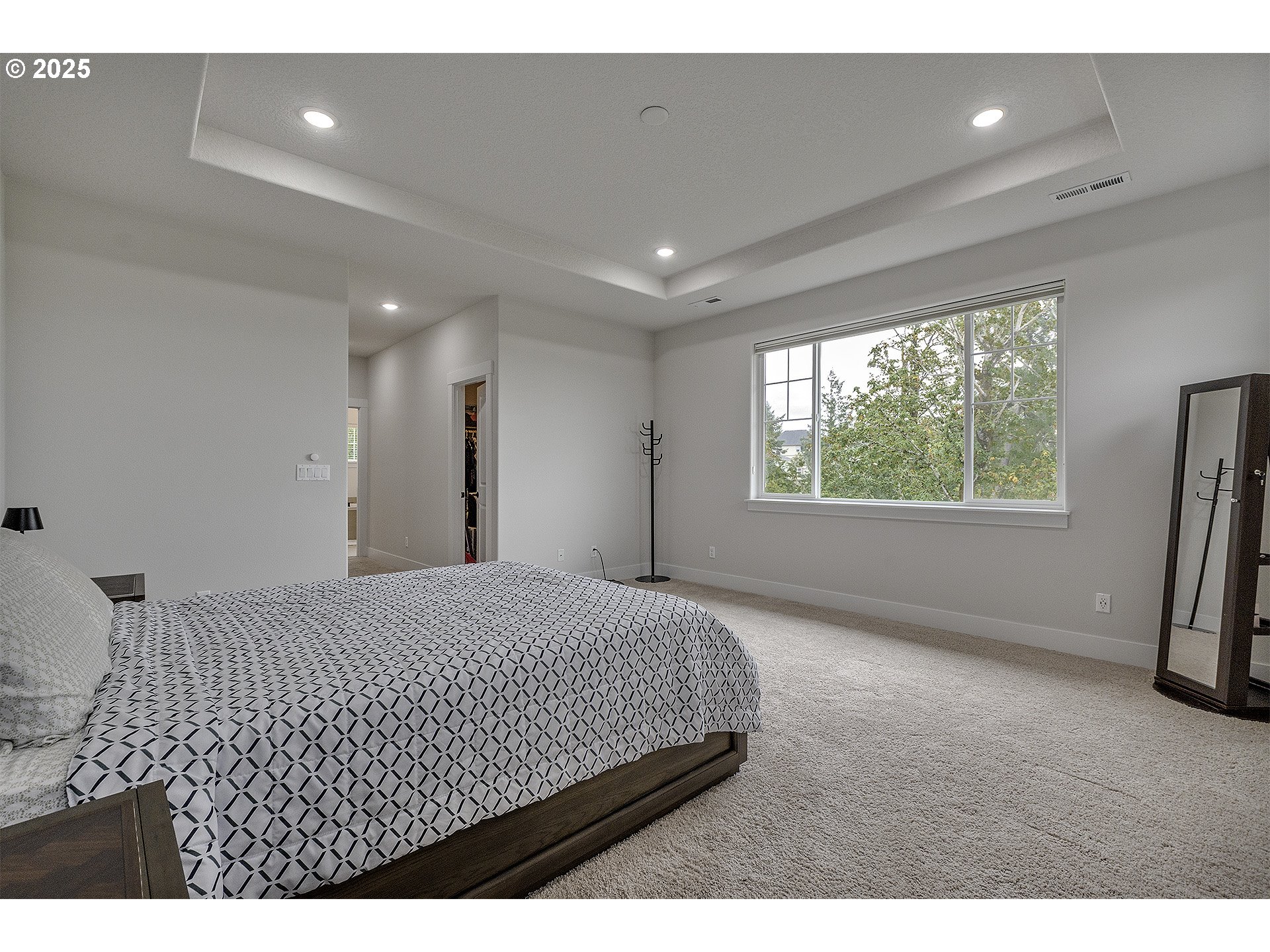 15080 Northwest Legend Street Portland, OR 97229 - Photo 22 of 38 a bedroom with a bed and a large window