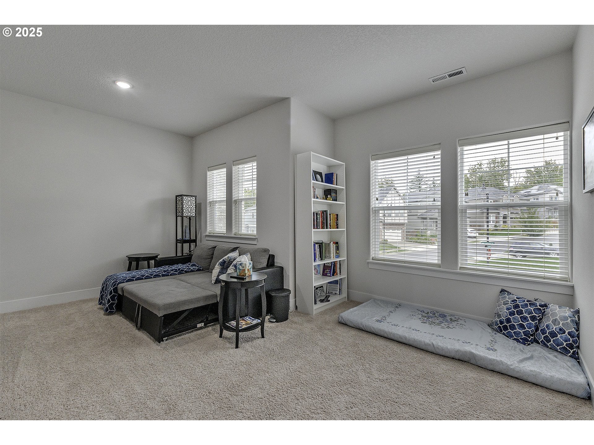 15080 Northwest Legend Street Portland, OR 97229 - Photo 24 of 38 a living room with furniture and a large window