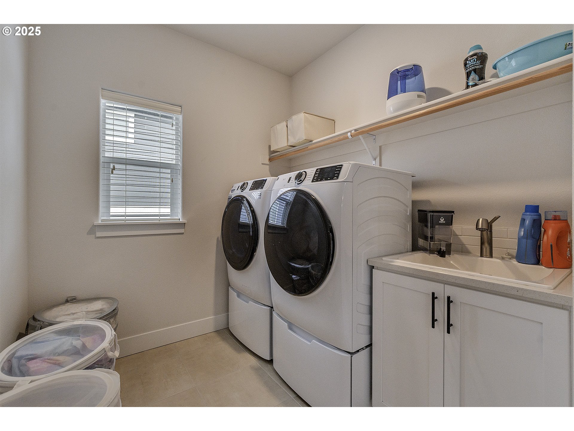 15080 Northwest Legend Street Portland, OR 97229 - Photo 30 of 38 a utility room with dryer and washer