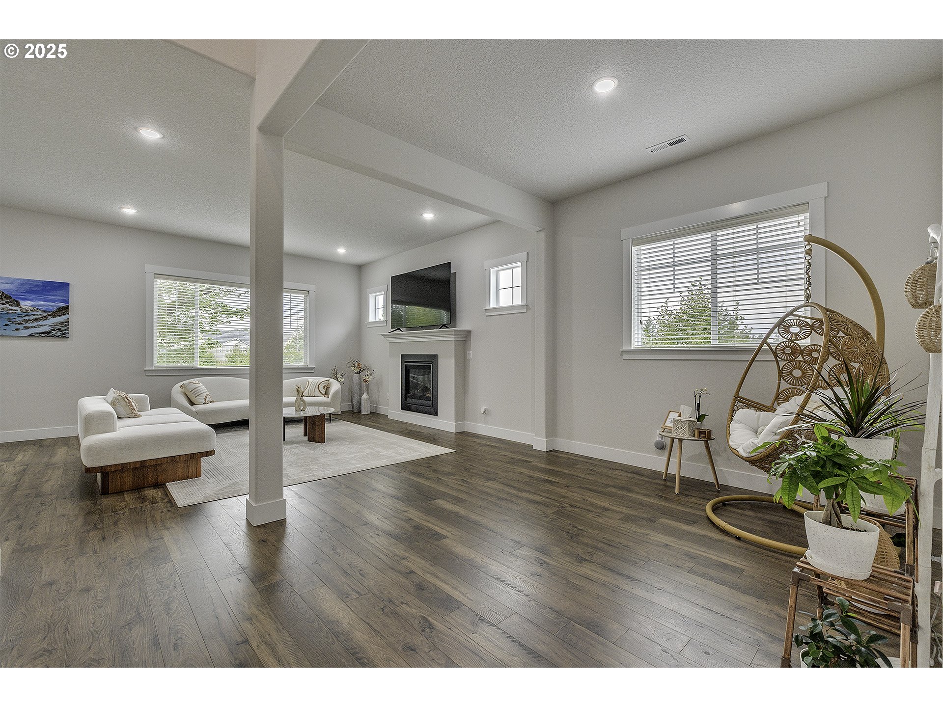 15080 Northwest Legend Street Portland, OR 97229 - Photo 3 of 38 a living room with furniture and a wooden floor