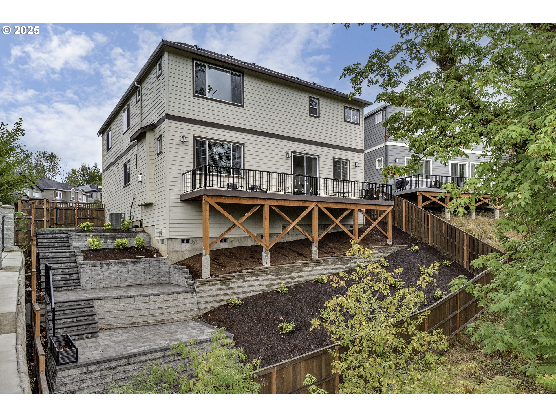 15080 Northwest Legend Street Portland, OR 97229 - Photo 34 of 38 a view of a house with chairs and wooden fence