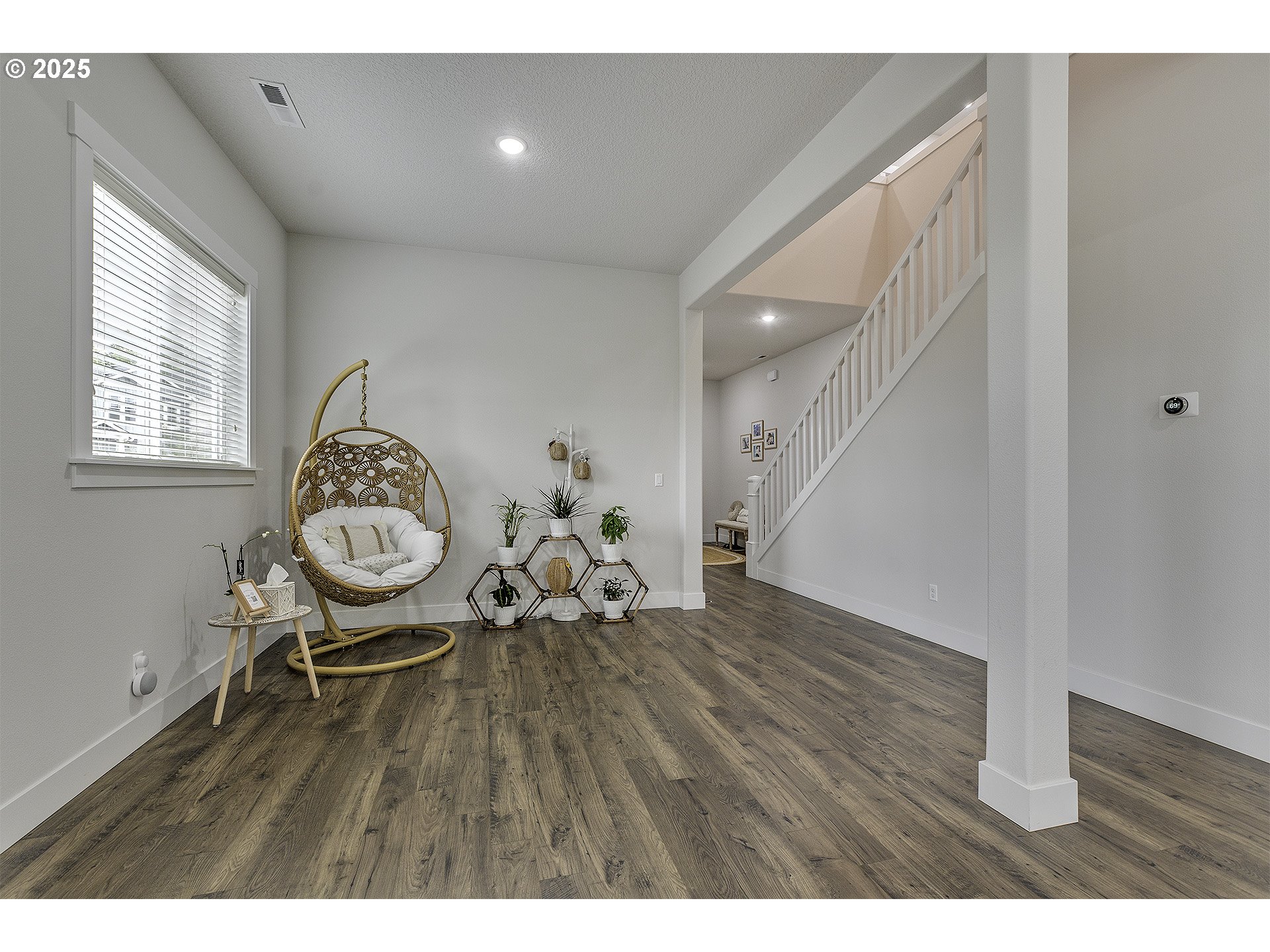 15080 Northwest Legend Street Portland, OR 97229 - Photo 4 of 38 a view of a livingroom with furniture and wooden floor