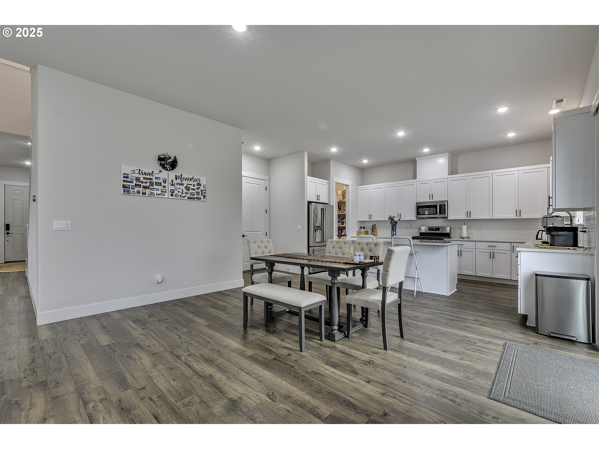 15080 Northwest Legend Street Portland, OR 97229 - Photo 8 of 38 a kitchen with kitchen island wooden cabinets and counter space