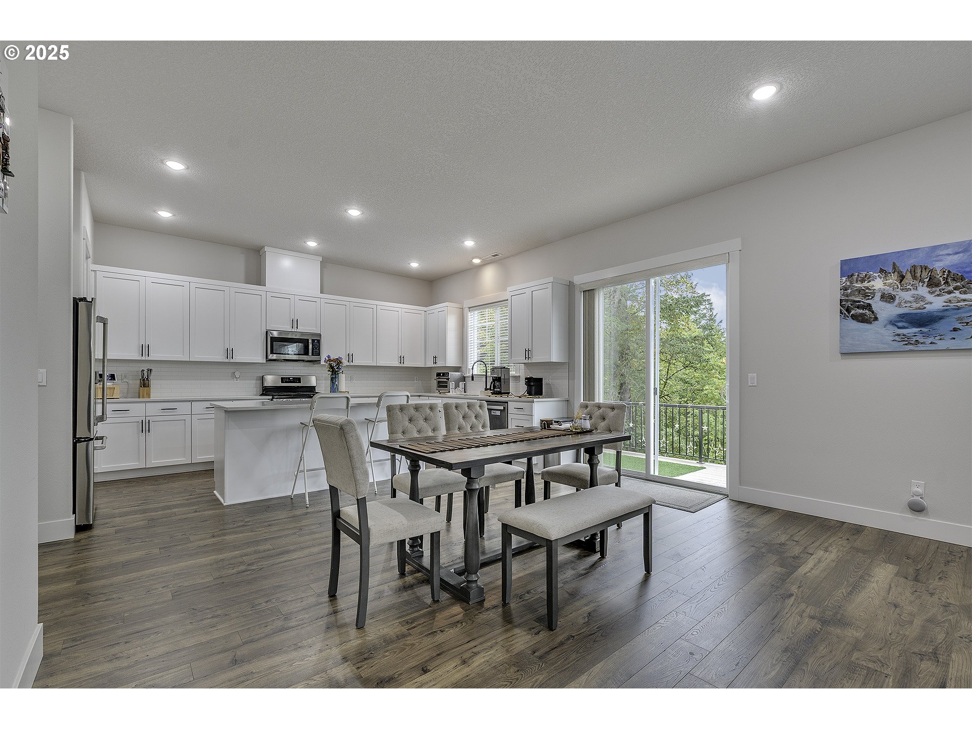 15080 Northwest Legend Street Portland, OR 97229 - Photo 9 of 38 a view of a dining room with furniture and wooden floor