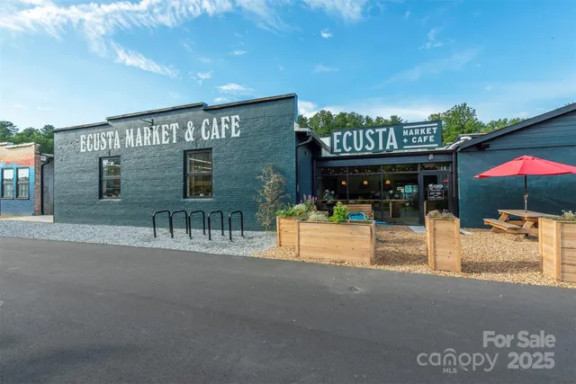 a view of a cafe with sitting area