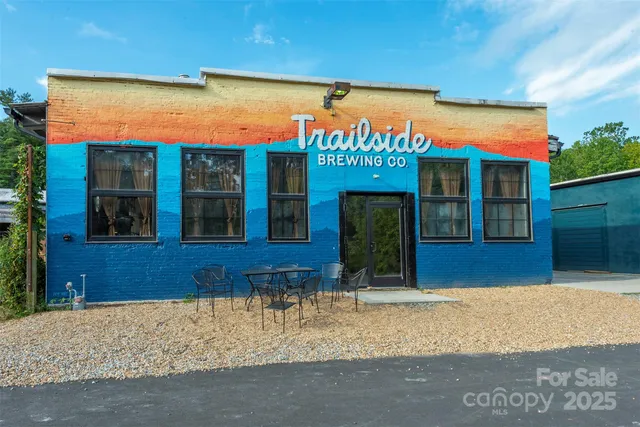 a front view of building with retail shops