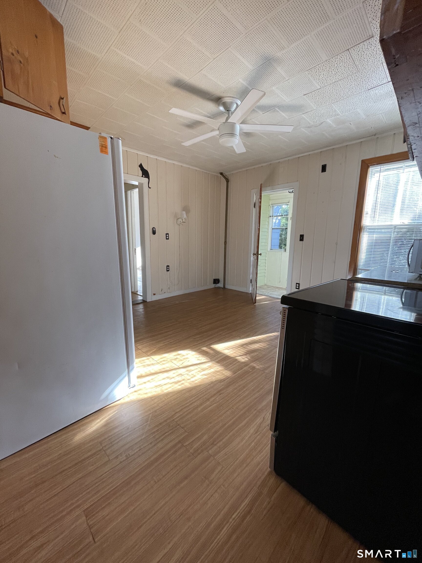52 Oneco Street Norwich, CT 06360 - Photo 5 of 14 Kitchen with fan and updated appliances
