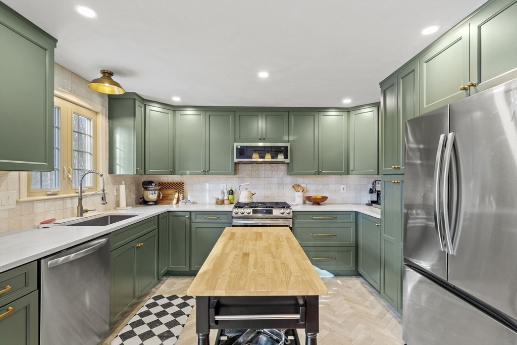 4 Apple Ridge Road, Unit 6 Maynard, MA 01754 - Photo 2 of 40 a kitchen with kitchen island stainless steel appliances a sink stove and refrigerator